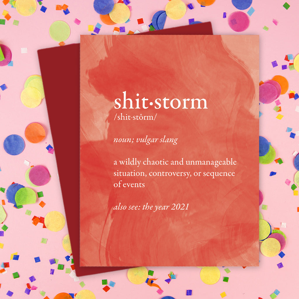 Shitstorm holiday card with red envelope on a colorful confetti background